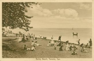 Sepia toned picture of many people standing an sitting on a lakeside beach.