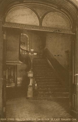 Sepia toned picture of a grand Victorian staircase.