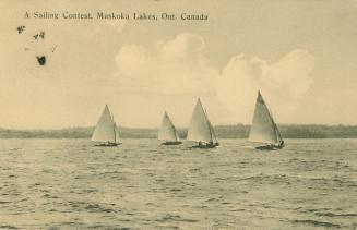 Black and white picture of four sailboats racing on a lake.