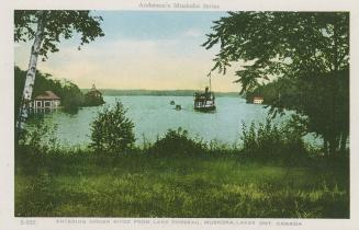 View from a height of large lake and a steam boat. 