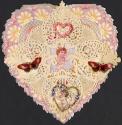 A heart-shaped card with silvery-purple background. At the centre a cherub holds a card. Lace s ...