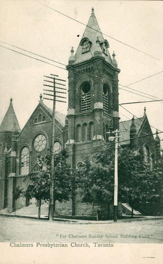 Picture of church on a corner with large tower. 