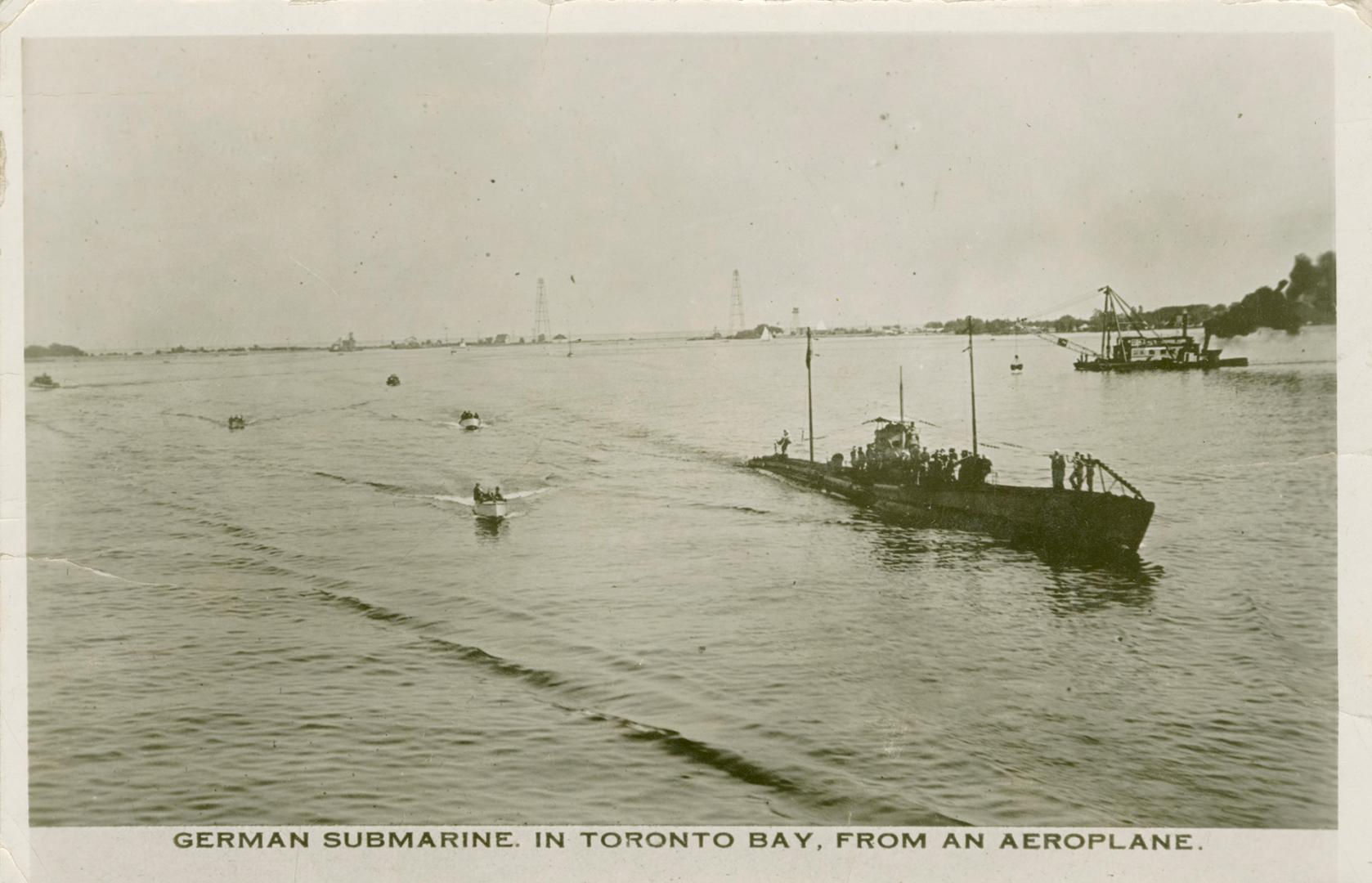 Black and white photograph of a submarine emerging from a body of water.