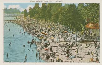 Picture of a crowded beach beside a body of water.