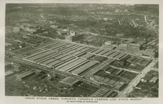 Aerial shot of rows of industrial buildings. Black and white.