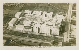 Aerial shot of a hospital complex. Black and white.
