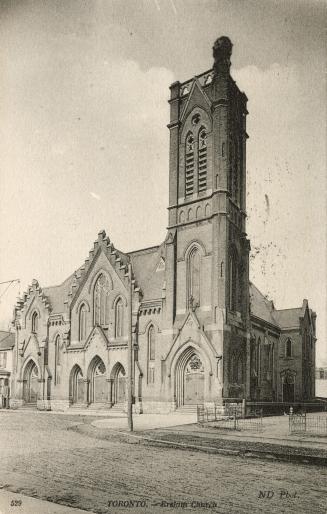 Picture of large church building with square tower. 