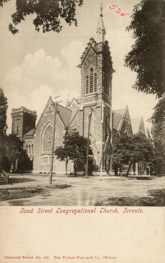 Picture of large church building with steeple surrounded by trees. 