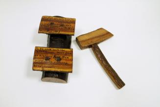 A wooden gavel and block.