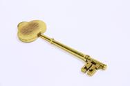 A decorative brass key.