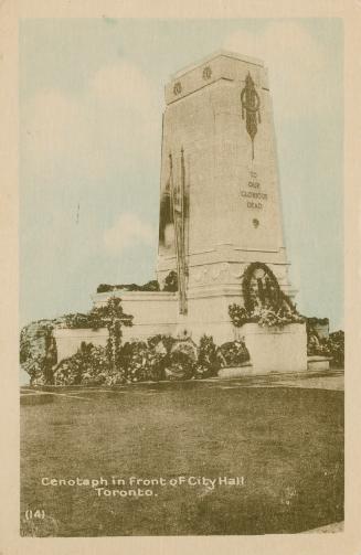 Colorized photograph of a tall, square stone monument with wreaths placed at it's base.