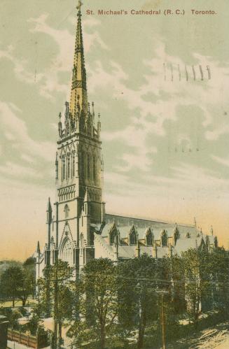 Picture of large cathedral church surrounded by trees. 