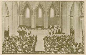 Picture of crowd seated inside a church. 