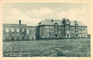 Black and white photograph of a three story collegiate building.