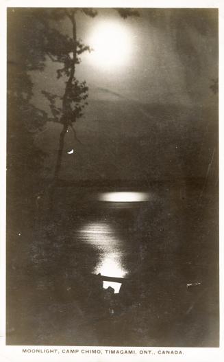 Black and white photograph of a lake in a wild, wooded area. Full moon in the sky.