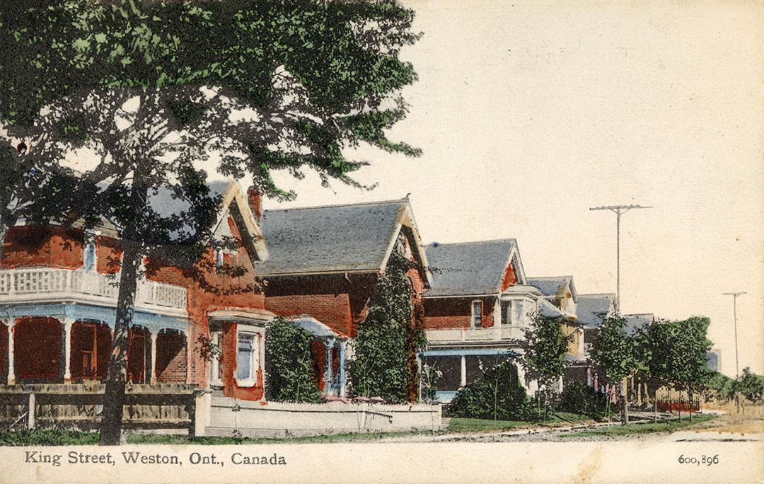 Colorized photograph of a city street in a residential area. 
