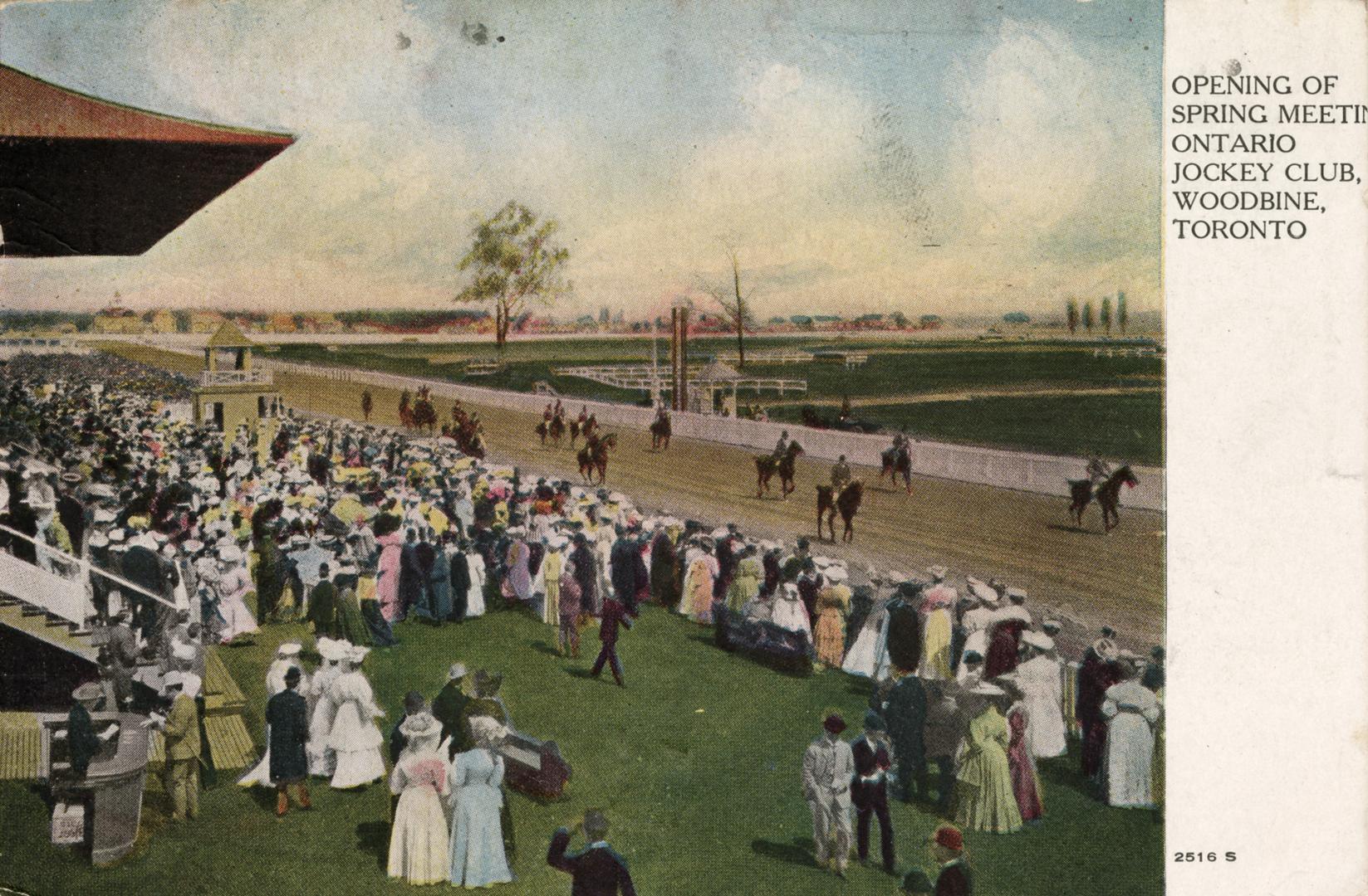 Group of people at a race track. 