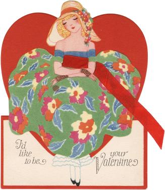 A woman in a green and blue dress and a summer hat stands in front of a large red heart.Printed…