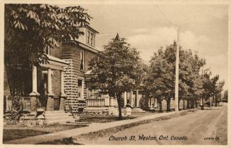 Sepia toned photograph of a city street in a residential area.