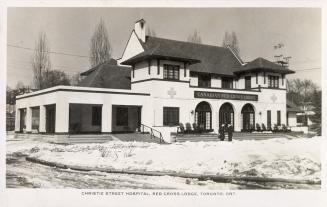 Black and white photograph of a two story hospital building.
