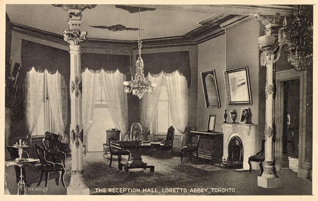 Black and white photograph of a large formal drawing room.