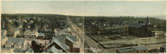 Picture of large school house with tower and surrounding streets and houses. This is a double w…