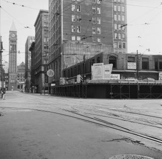 A photograph of a city street, with skyscrapers on the right side of the street and Toronto Old ...