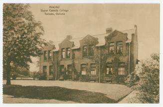 Sepia toned photograph of a two story medical building with caption "Hospital//Upper Canada Col ...