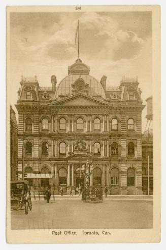 Sepia toned photograph of a large four story building in the Second-empire style of architectur ...