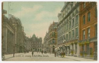 Colorized photograph of a city street with tall building on either side. Large, Second Empire s ...