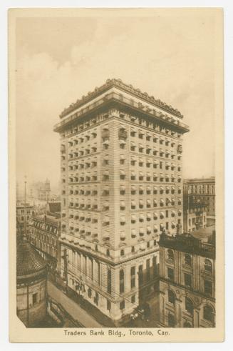 Sepia toned photograph of an early skyscraper in the right hand side of a busy city street.