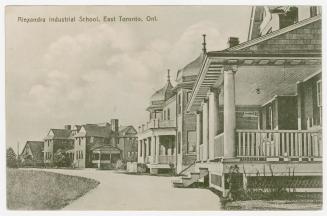 Photo of row of buildings on curved street. 