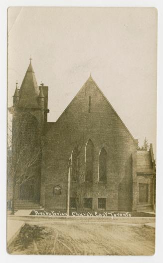 Picture of a church with tower on left side. 
