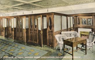Colorized photograph of series of elegant booths with a desk and rattan chairs in the front.