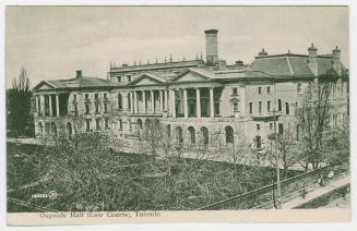 Picture of law buildings with front lawn with trees and fence on right side. 