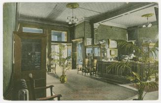 Colorized photograph of the interior of a hotel lobby.