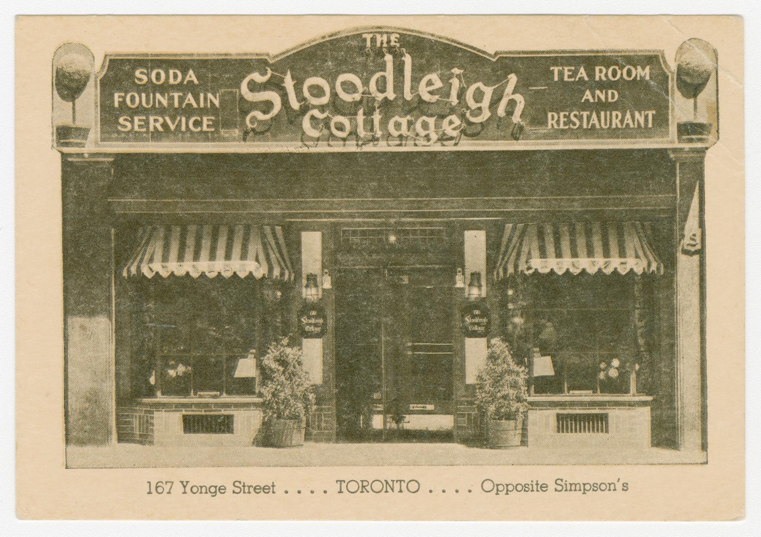 Black and white photograph of the front entranceway of a restaurant.