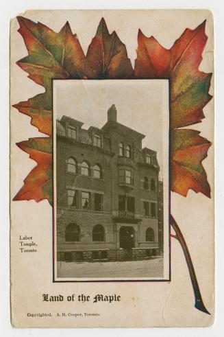 Picture of large brick and stone building set in border with large maple leaf. 