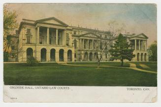Picture of large buildings facing lawn and trees with white border along bottom. 