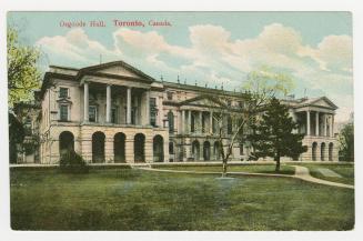 Picture of large buildings facing lawn and trees.