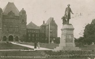 Black and white photograph of a huge Richard Romanesque building with a statue of a man in a fr ...