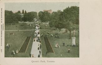Colorized photograph (aerial view) of a huge crowd of people walking on pathways and lawn in a  ...
