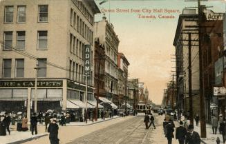 Colour postcard depicting a photo of Queen Street looking east towards an approaching trolley c ...