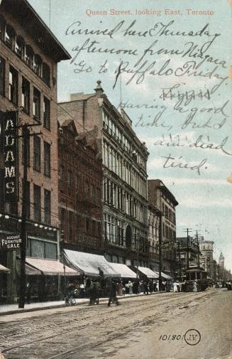 Colour postcard depicting a photo of Queen Street looking east towards an approaching trolley c ...