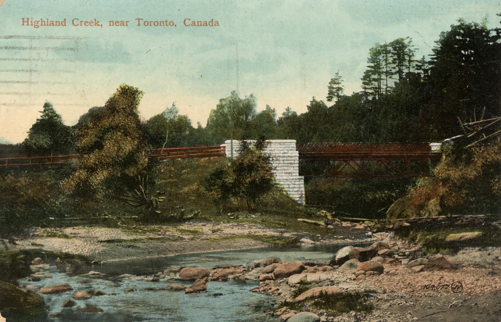 Picture of a bridge going over a creek. 