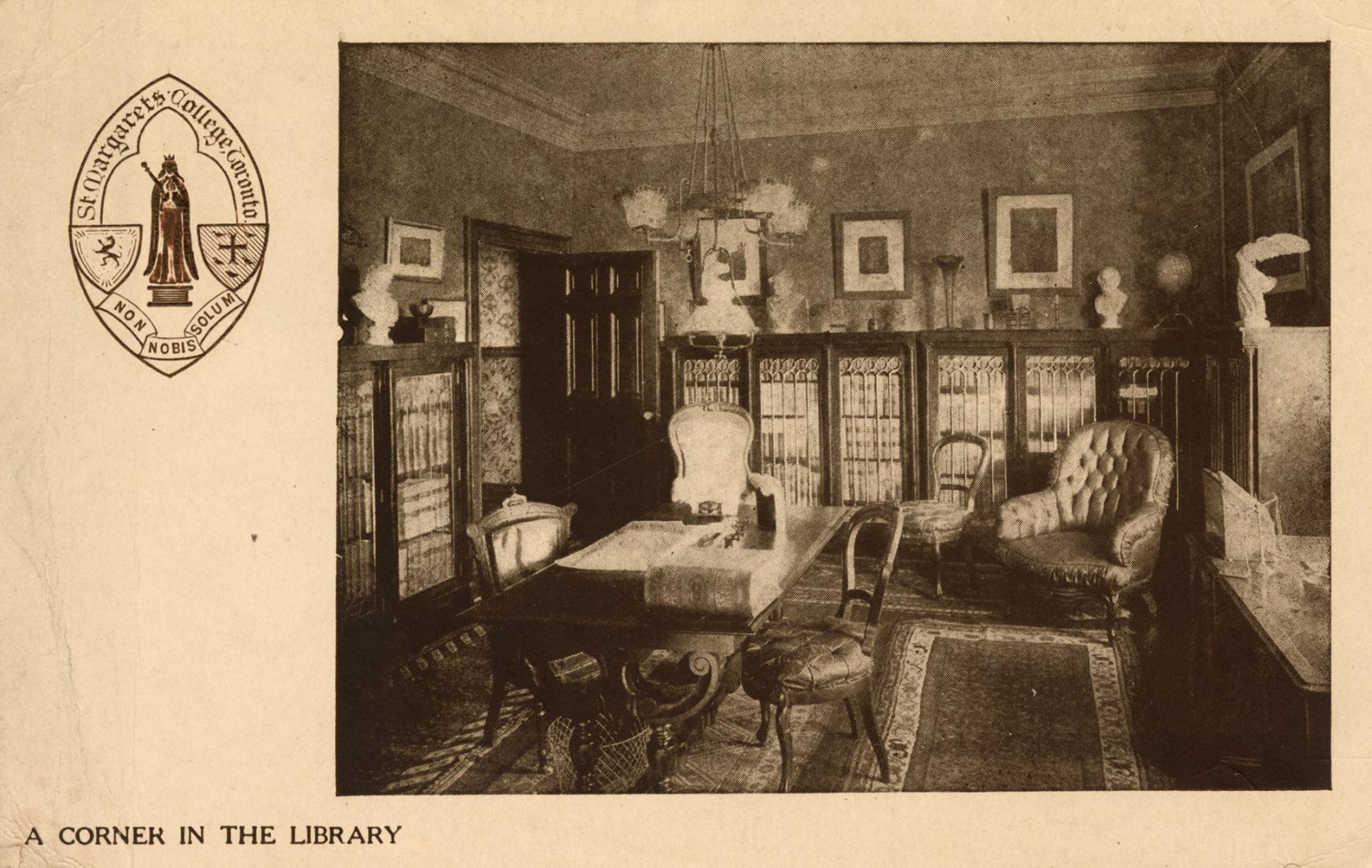 Picture of the interior of a library room with border and school crest on right side of card. 
