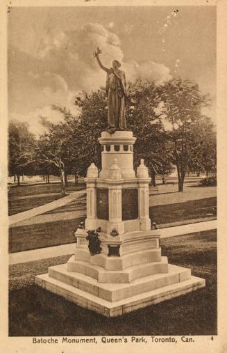 Picture of a large monument with woman on top. 