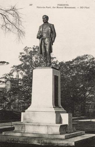 Picture of a large monument with man on top. 