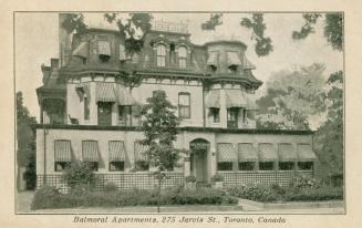 B/W postcard depicting a photo of the frontal exterior of an apartment building, with caption,  ...