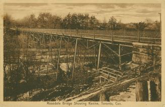 Sepia-toned postcard depicting a photo of the side view Rosedale Bridge with a stairway into th ...